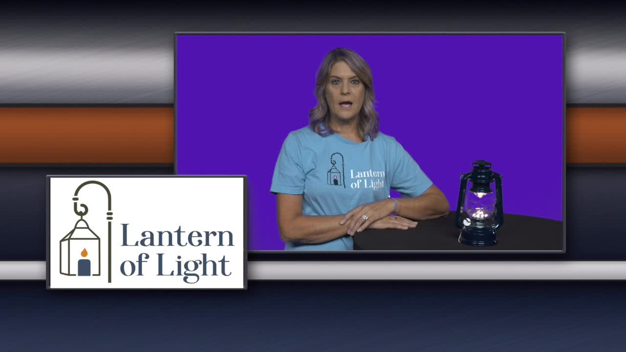 Volunteer with Lantern of Light